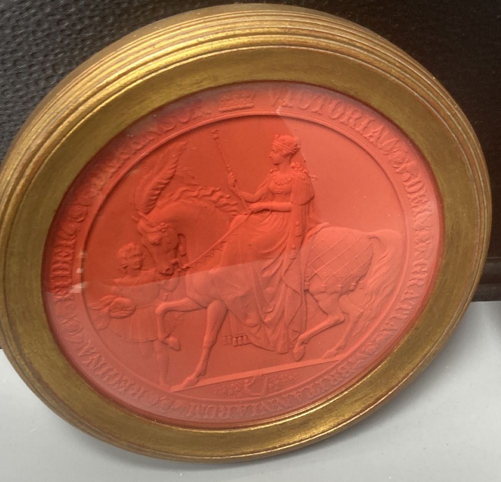 Two mid 19th century Great Seals of Queen Victoria, relief designs in red wax, later framed